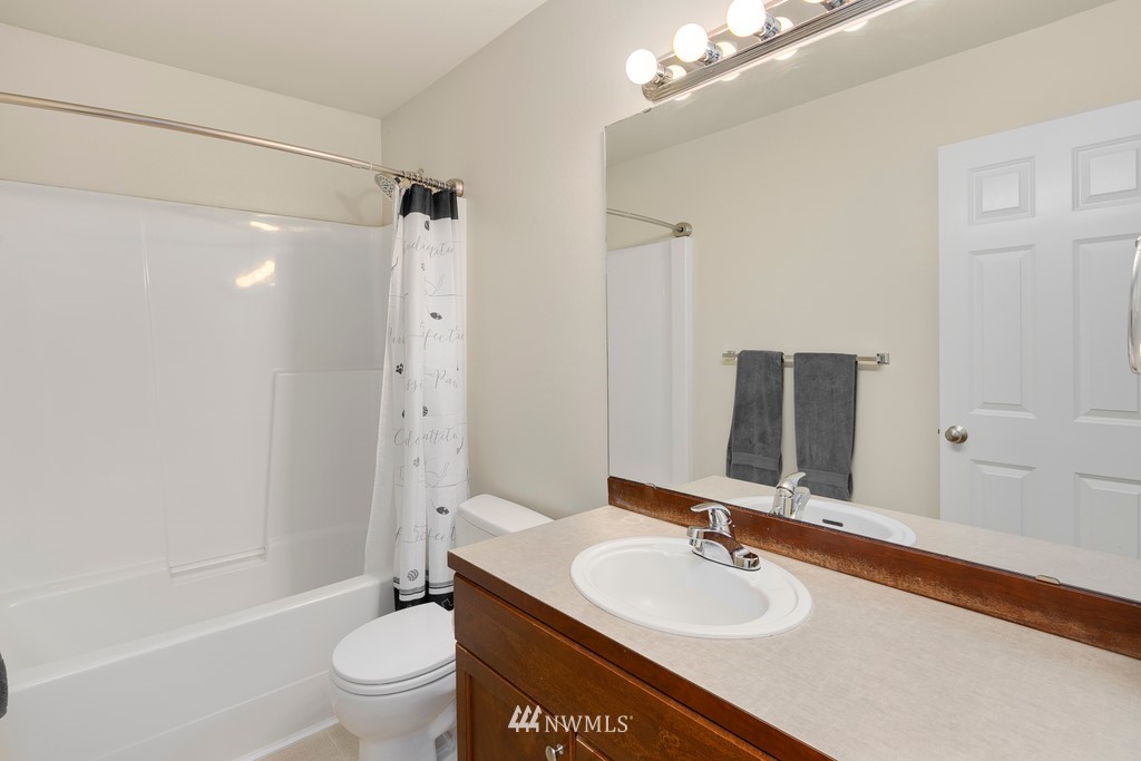 2425 194th Street Southeast, Unit 40 Bothell, WA 98012 - Photo 16 of 20 a bathroom with a sink toilet tub and shower