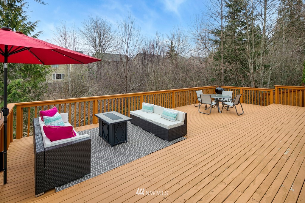 2425 194th Street Southeast, Unit 40 Bothell, WA 98012 - Photo 18 of 20 an outdoor sitting area with furniture and wooden floor