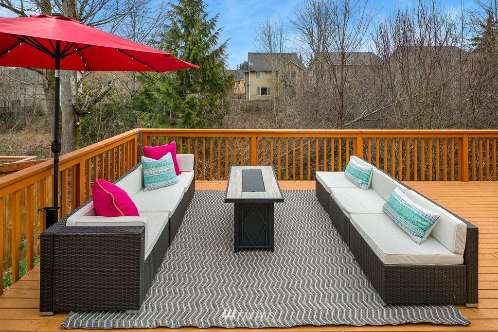 2425 194th Street Southeast, Unit 40 Bothell, WA 98012 - Photo 19 of 20 a balcony with wooden floor and outdoor seating