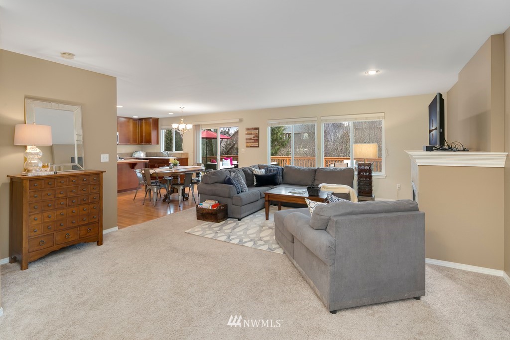 2425 194th Street Southeast, Unit 40 Bothell, WA 98012 - Photo 3 of 20 a living room with furniture and a flat screen tv