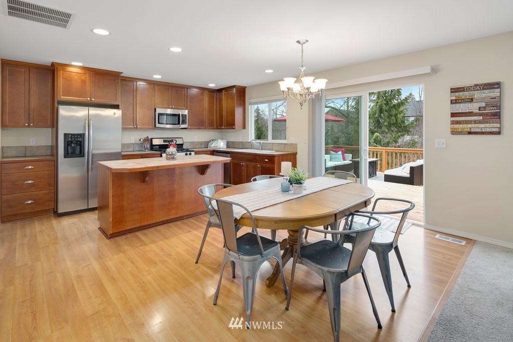 2425 194th Street Southeast, Unit 40 Bothell, WA 98012 - Photo 7 of 20 a view of a dining room with furniture window and outside view