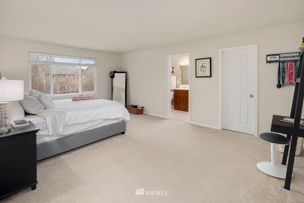 2425 194th Street Southeast, Unit 40 Bothell, WA 98012 - Photo 9 of 20 a bedroom with a bed furniture and a window
