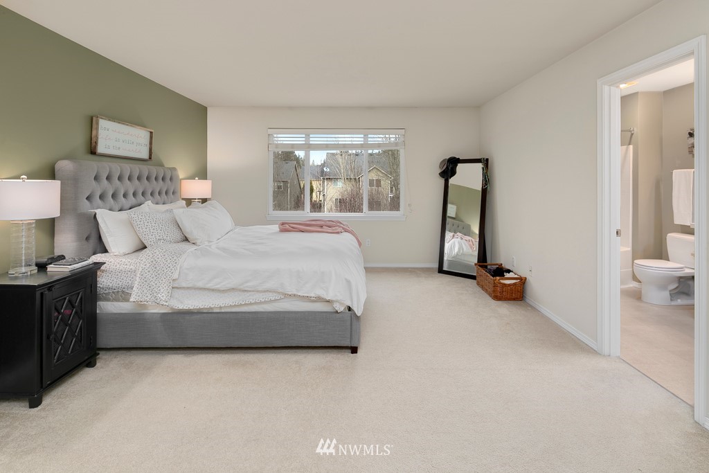 2425 194th Street Southeast, Unit 40 Bothell, WA 98012 - Photo 10 of 20 a bedroom with bed and large windows