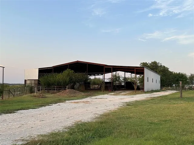 a swimming pool with outdoor seating and yard