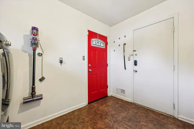 a bedroom with furniture and a potted plant