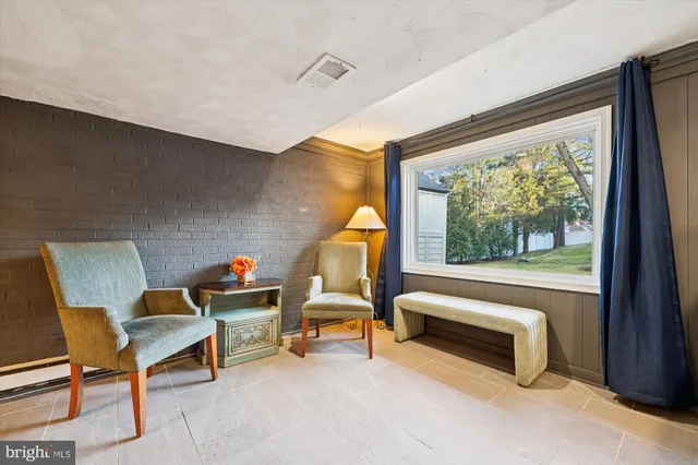 a view of a kitchen with a dining table and chairs