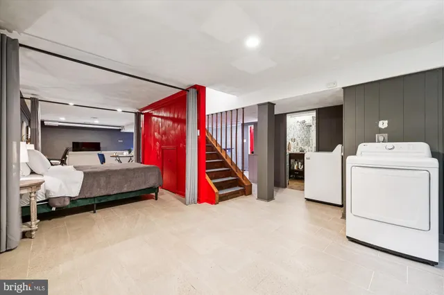 a white toilet sitting next to a shower curtain