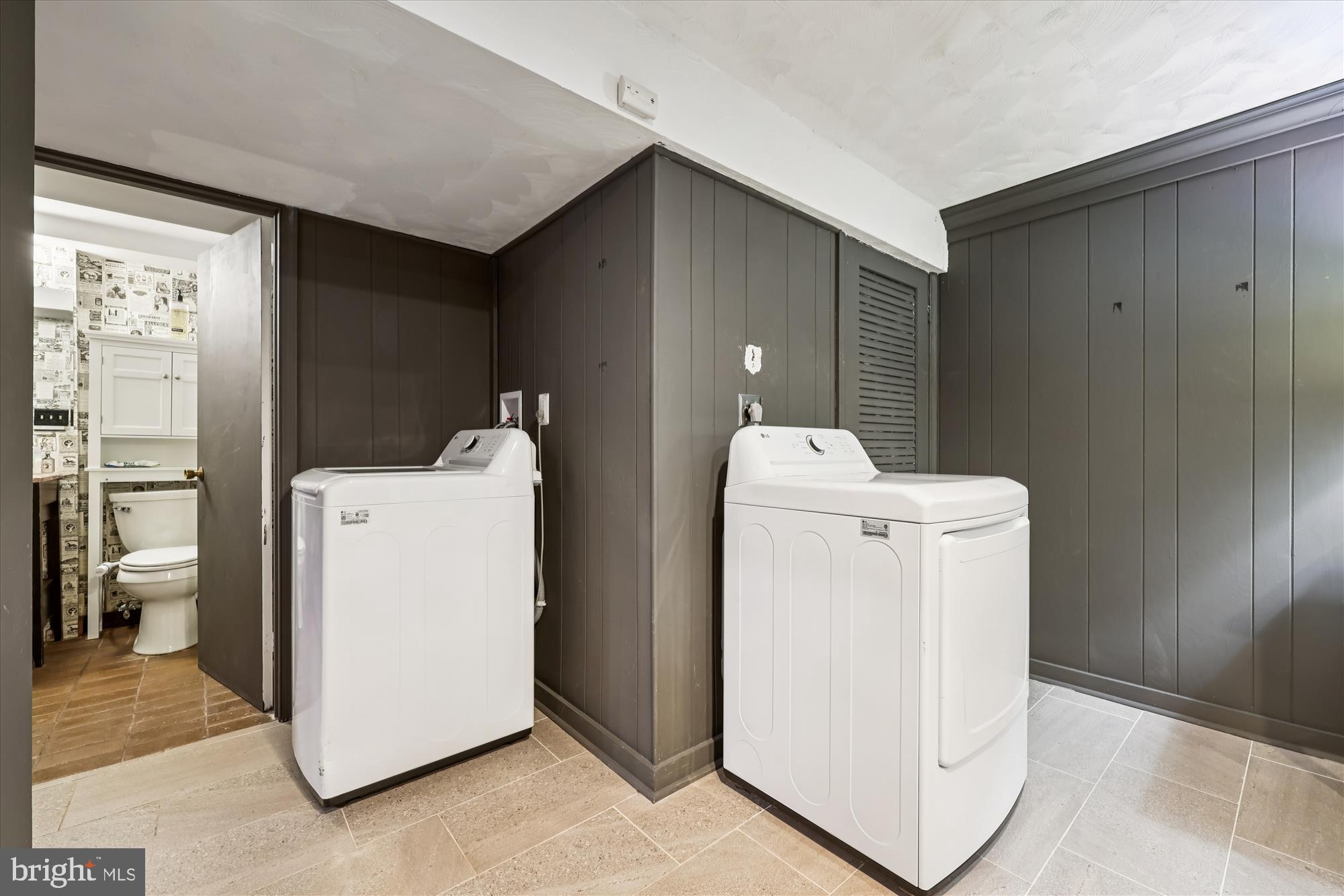 9304 Bells Mill Road Potomac, MD 20854 - Photo 61 of 74 a utility room with dryer and washer