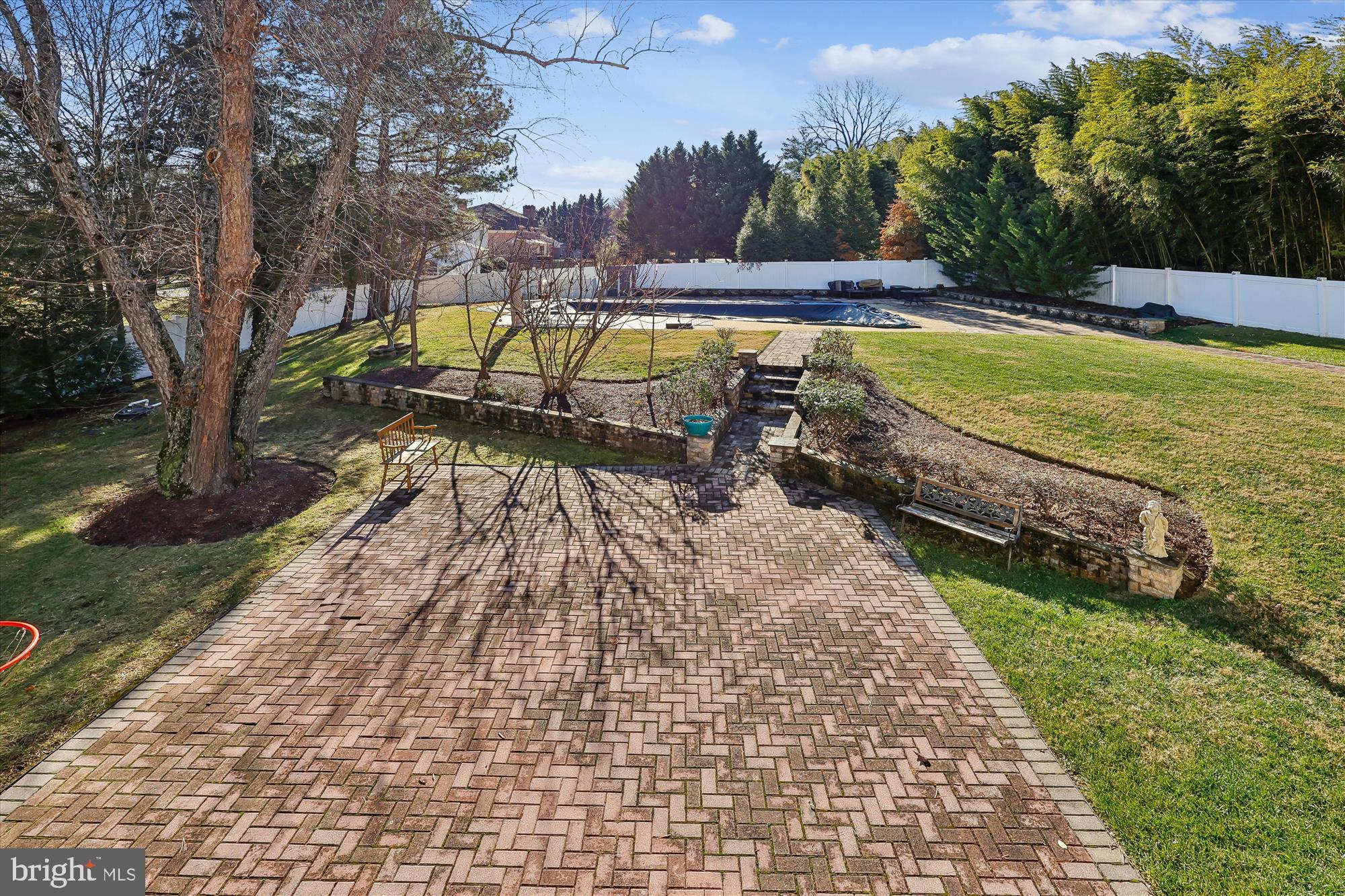 9304 Bells Mill Road Potomac, MD 20854 - Photo 68 of 74 a view of a swimming pool with a patio