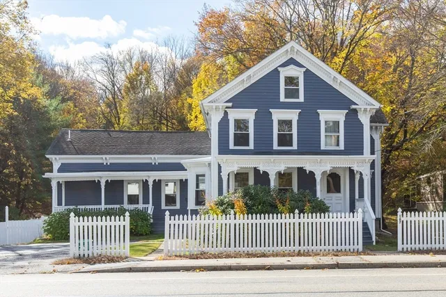 a front view of a house with a garden