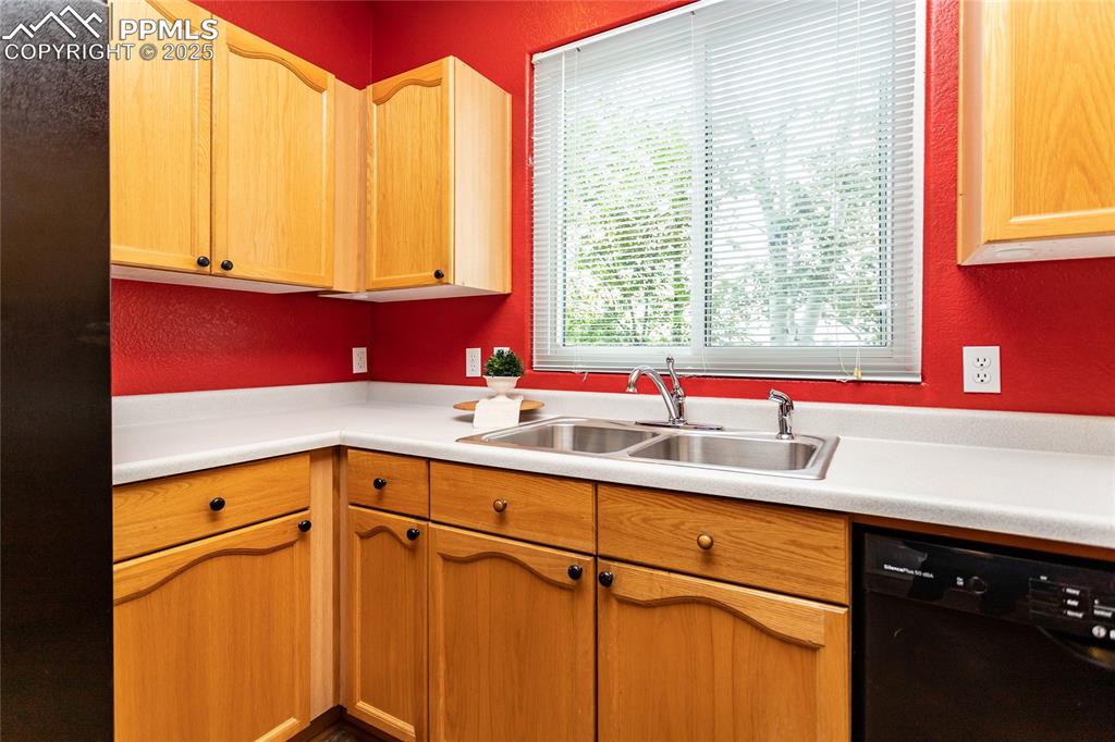 6815 Anchor Point Colorado Springs, CO 80922 - Photo 13 of 46 a kitchen with a sink and a window