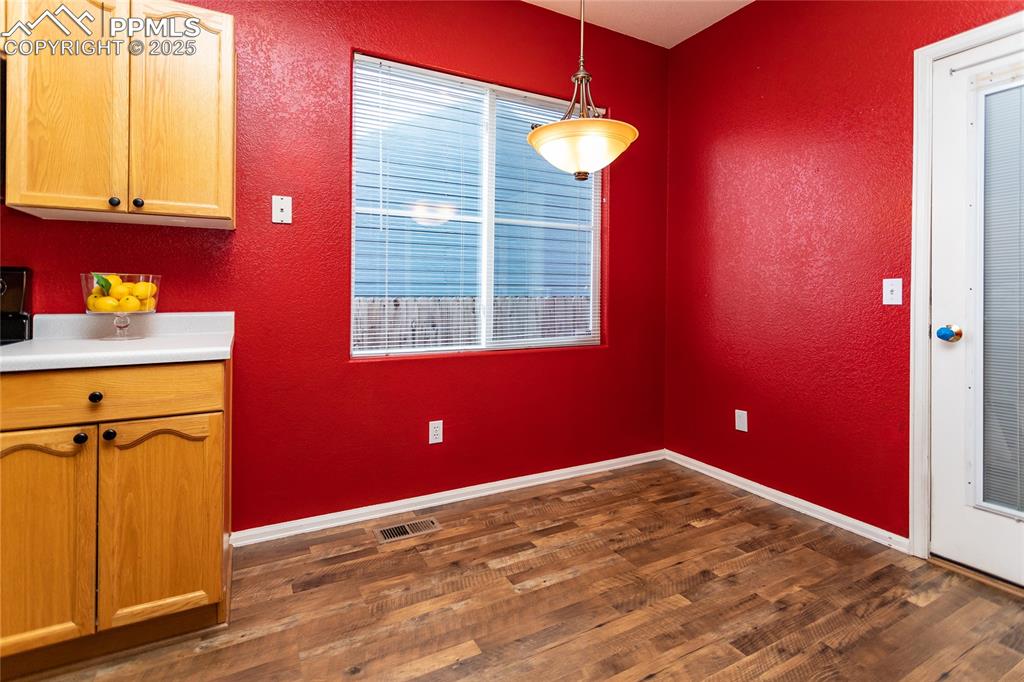6815 Anchor Point Colorado Springs, CO 80922 - Photo 16 of 46 a view of a livingroom with an empty space and a window