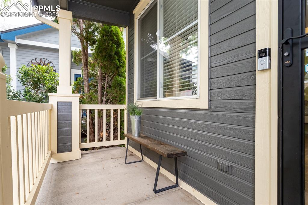 6815 Anchor Point Colorado Springs, CO 80922 - Photo 2 of 46 a view of a house with a bench and wooden fence