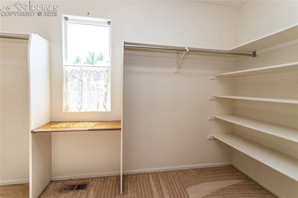 6815 Anchor Point Colorado Springs, CO 80922 - Photo 31 of 46 a view of an empty room with a window
