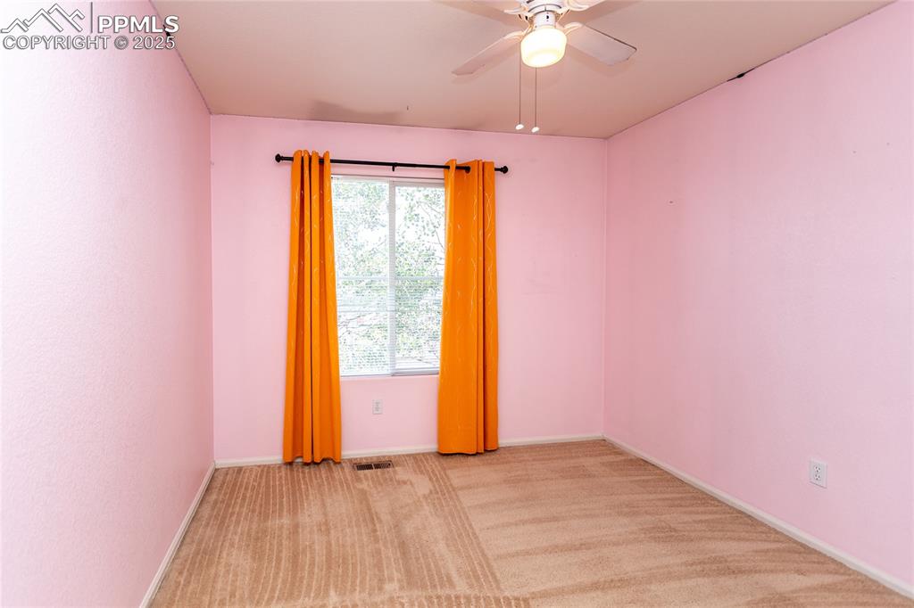 6815 Anchor Point Colorado Springs, CO 80922 - Photo 32 of 46 a view of an empty room with a window