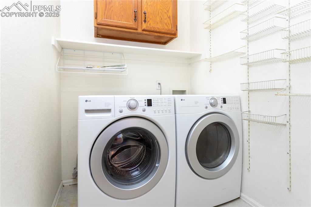 6815 Anchor Point Colorado Springs, CO 80922 - Photo 39 of 46 a utility room with dryer and washer
