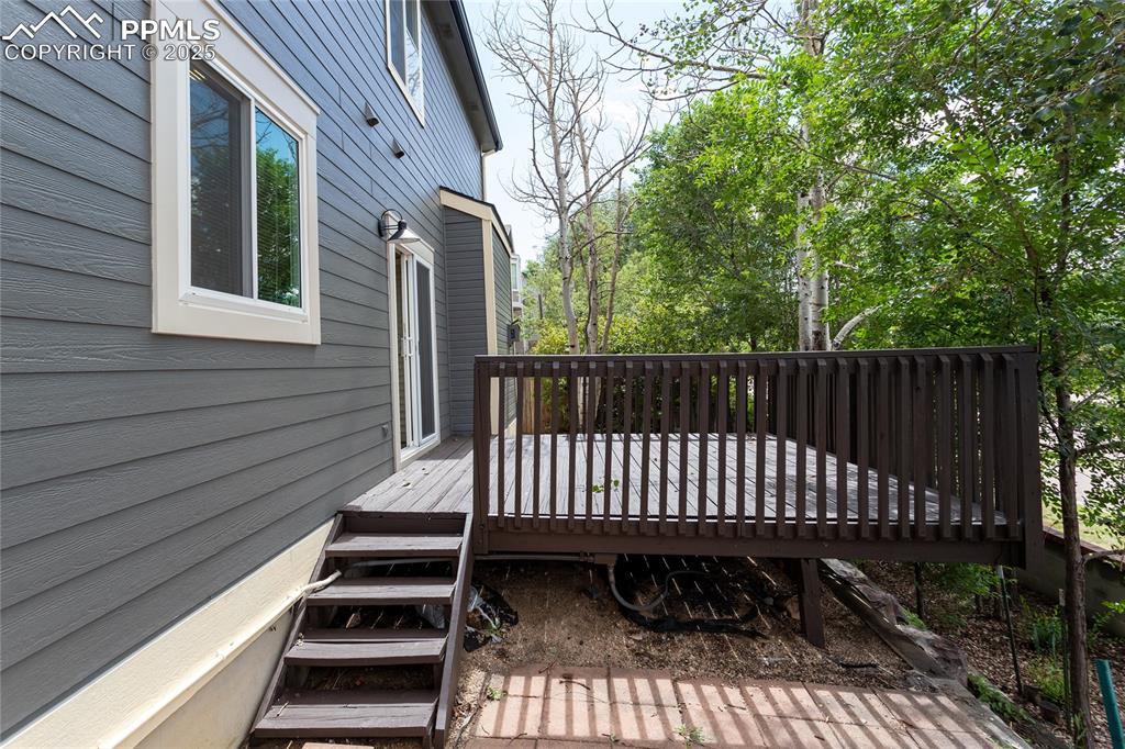 6815 Anchor Point Colorado Springs, CO 80922 - Photo 42 of 46 a view of outdoor space with deck and furniture