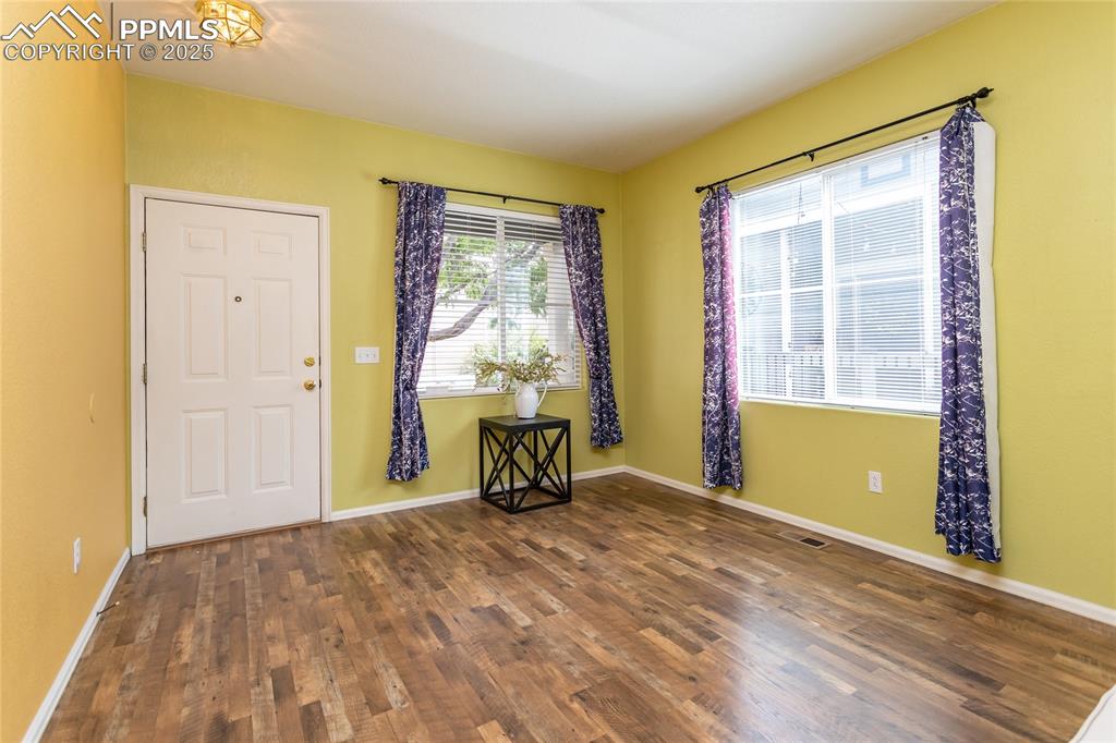6815 Anchor Point Colorado Springs, CO 80922 - Photo 8 of 46 a view of an empty room with a window