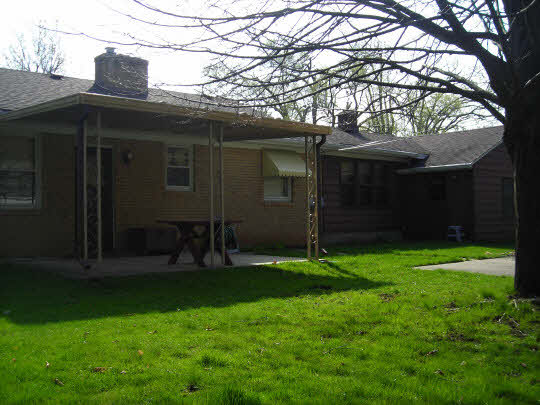1621 Warren Road Rockford, IL 61108 - Photo 11 of 11 a backyard of a house with lots of green space