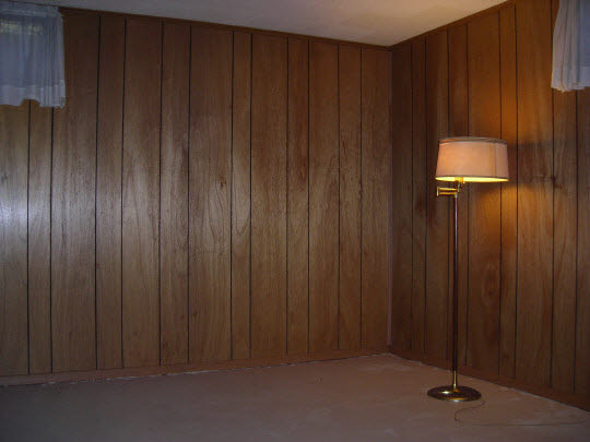 1621 Warren Road Rockford, IL 61108 - Photo 9 of 11 an empty room with wooden walls