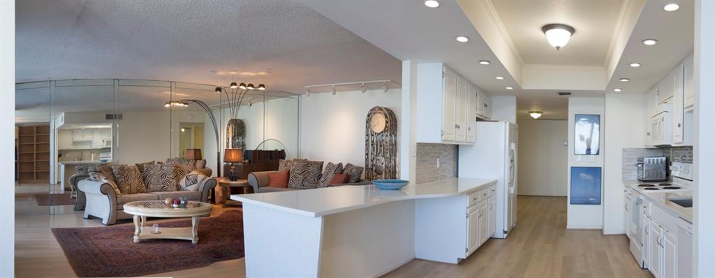 1800 South Ocean Boulevard, Unit 511 Pompano Beach, FL 33062 - Photo 17 of 48 a large living room with stainless steel appliances furniture a chandelier