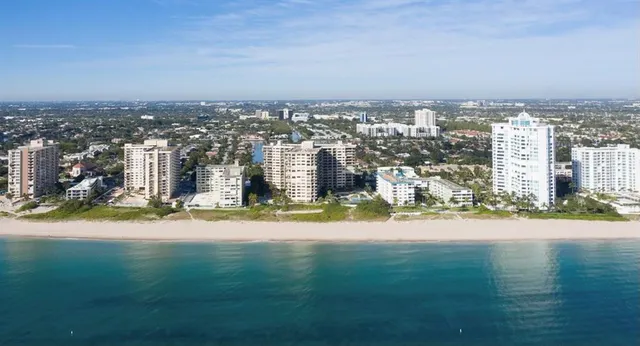 an aerial view of a city with lawn chairs