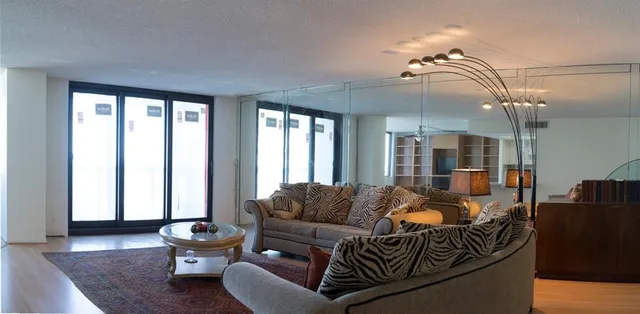 a living room with furniture and a window