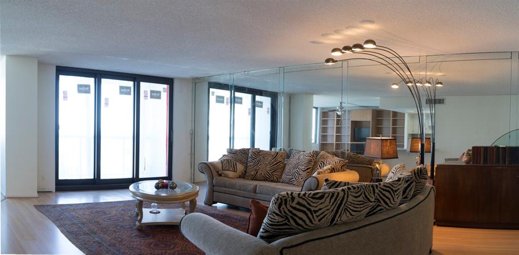 1800 South Ocean Boulevard, Unit 511 Pompano Beach, FL 33062 - Photo 22 of 48 a living room with furniture and wooden floor