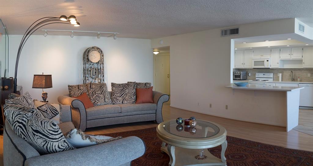 1800 South Ocean Boulevard, Unit 511 Pompano Beach, FL 33062 - Photo 23 of 48 a living room with furniture a mirror and a lamp