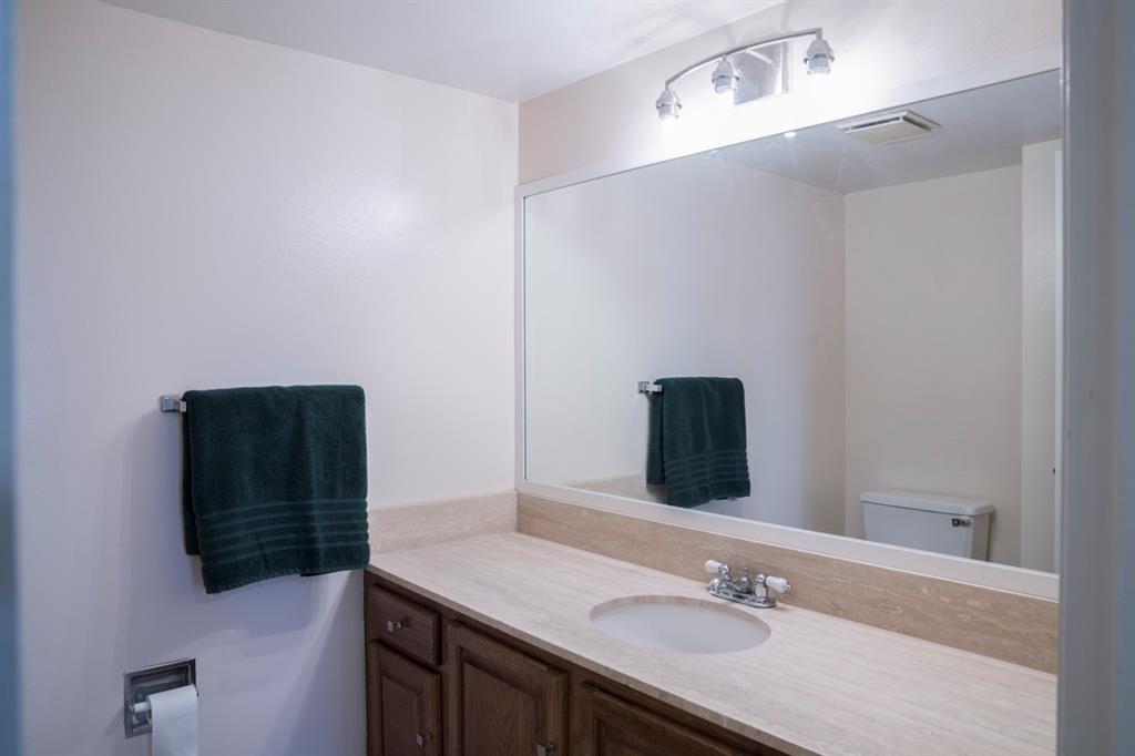 1800 South Ocean Boulevard, Unit 511 Pompano Beach, FL 33062 - Photo 28 of 48 a bathroom with a sink vanity and a mirror