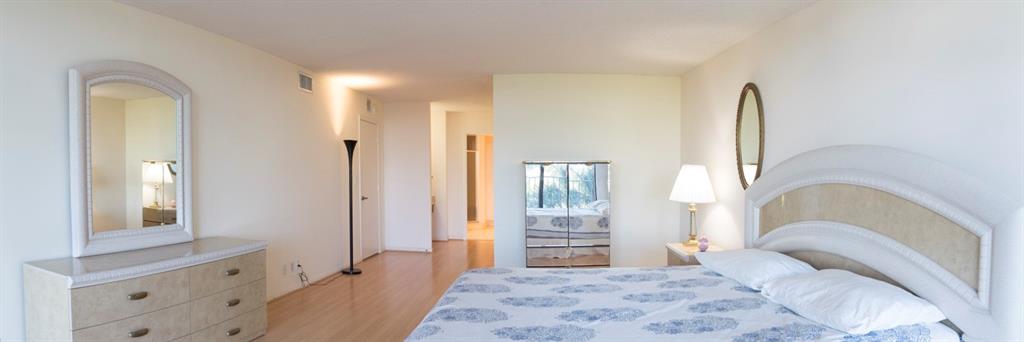 1800 South Ocean Boulevard, Unit 511 Pompano Beach, FL 33062 - Photo 33 of 48 a bedroom with a bed and a large mirror on the dresser