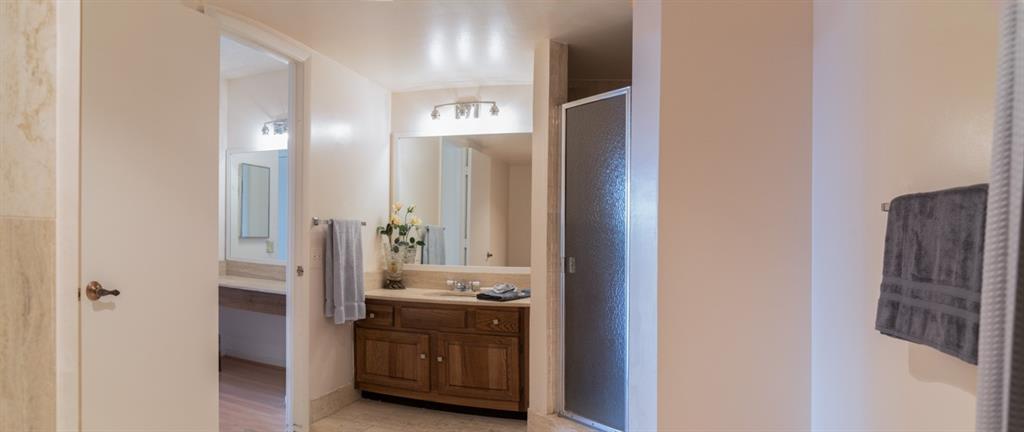1800 South Ocean Boulevard, Unit 511 Pompano Beach, FL 33062 - Photo 35 of 48 a bathroom with a double vanity sink and a mirror