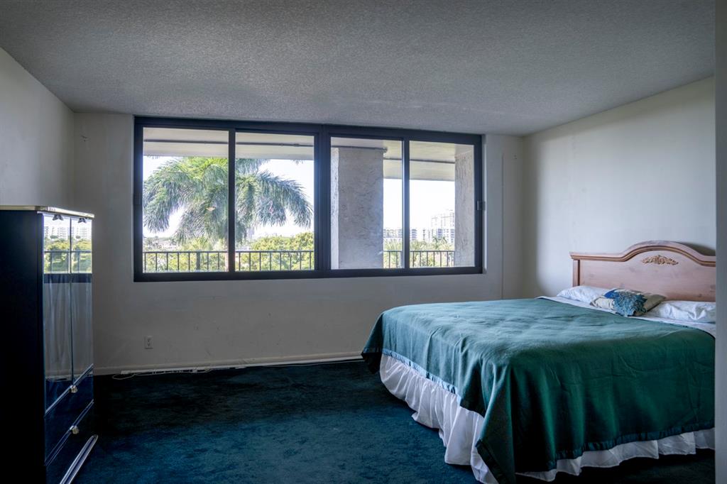 1800 South Ocean Boulevard, Unit 511 Pompano Beach, FL 33062 - Photo 39 of 48 a bedroom with a bed and window