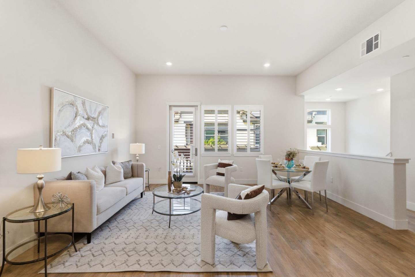 195 Carson Falls Common Fremont, CA 94539 - Photo 14 of 52 a living room with furniture and wooden floor