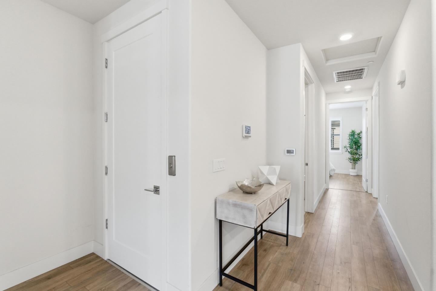 195 Carson Falls Common Fremont, CA 94539 - Photo 17 of 52 a view of a room with wooden floor and furniture