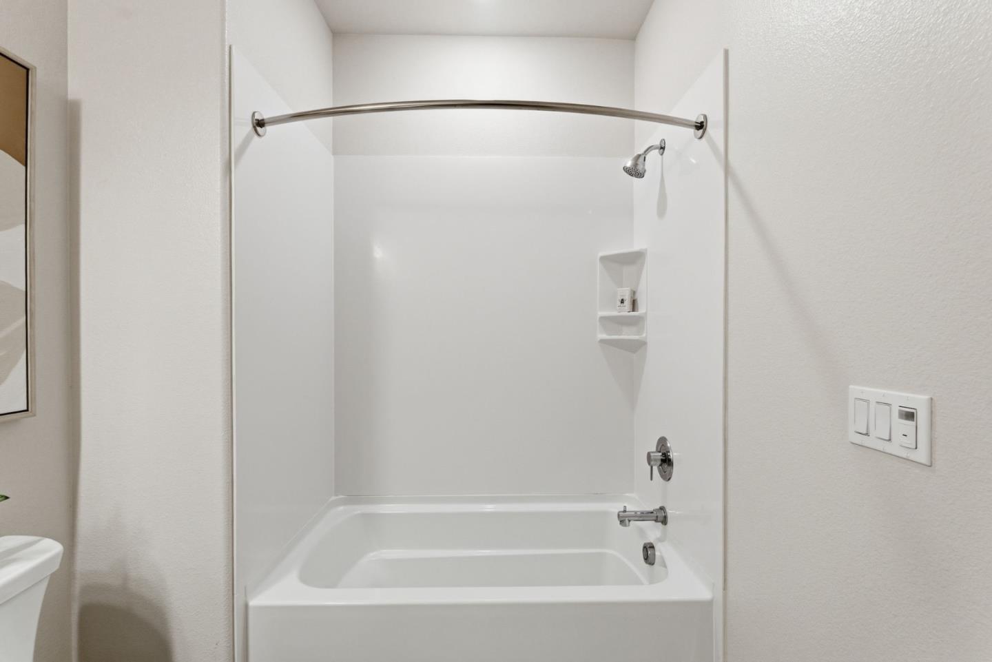 195 Carson Falls Common Fremont, CA 94539 - Photo 28 of 52 a bathroom with a bathtub and a shower
