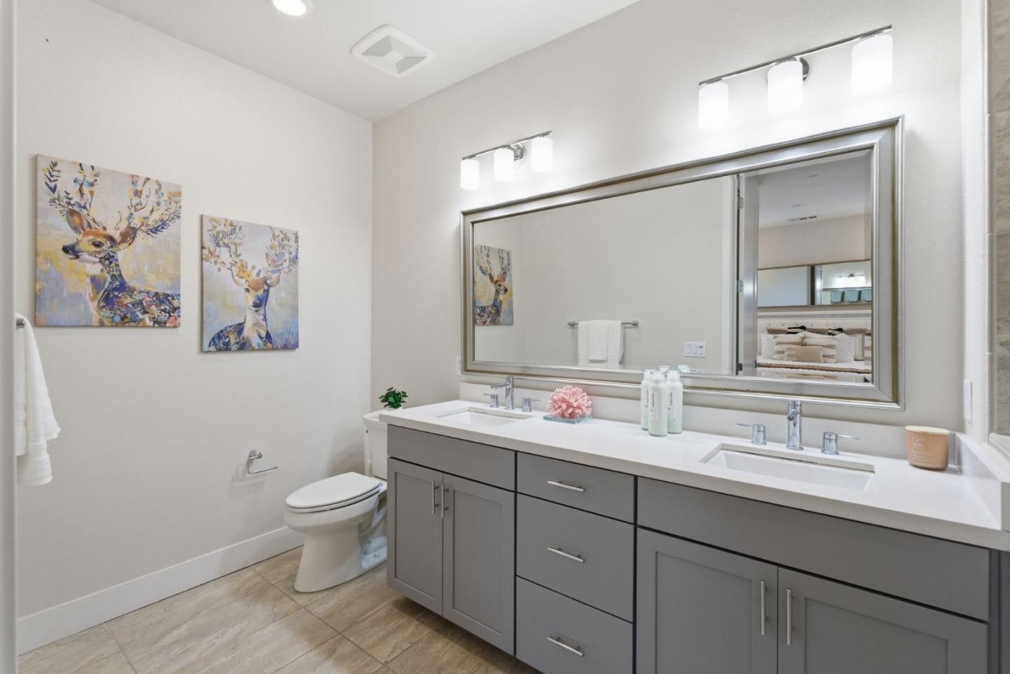 195 Carson Falls Common Fremont, CA 94539 - Photo 31 of 52 a bathroom with a toilet sink and mirror