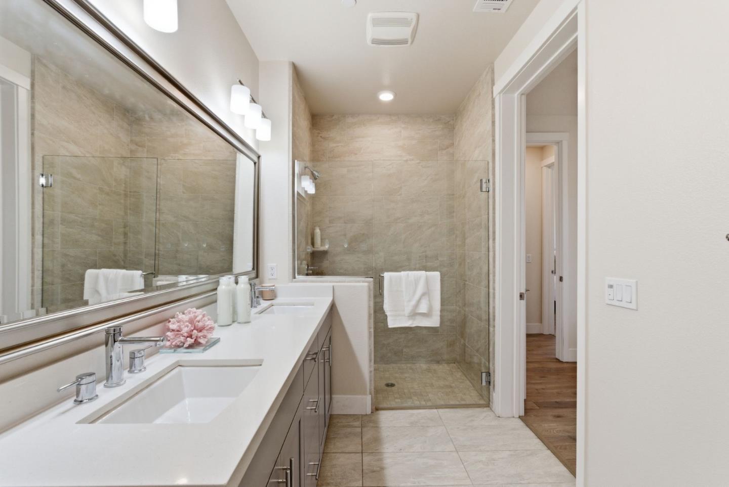 195 Carson Falls Common Fremont, CA 94539 - Photo 32 of 52 a bathroom with a double vanity sink and a mirror