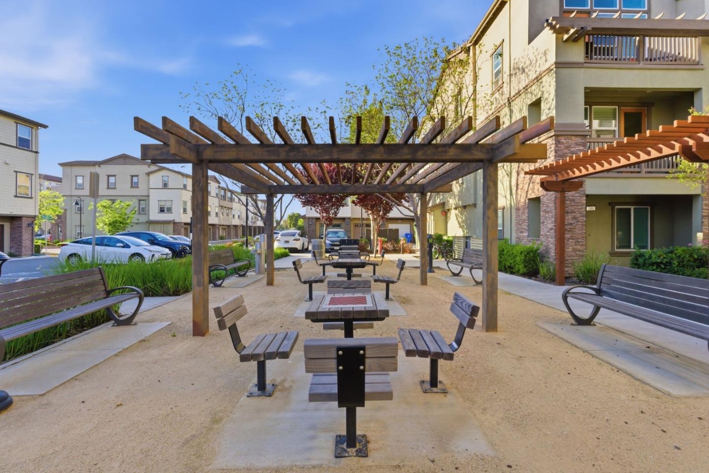 195 Carson Falls Common Fremont, CA 94539 - Photo 44 of 52 a view of a chairs and table in a patio