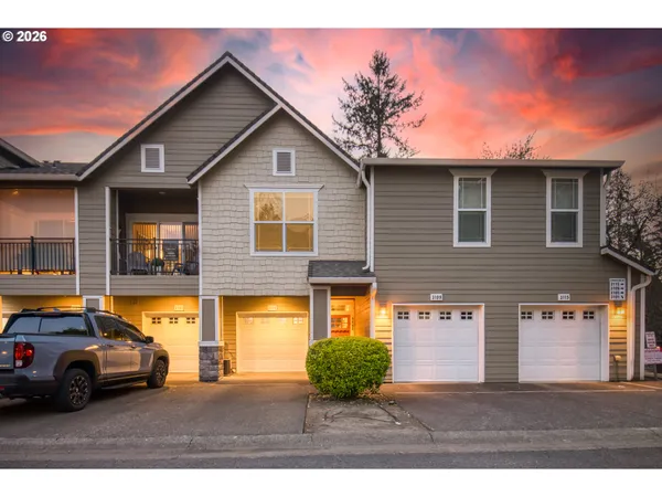 a front view of a house with parking space