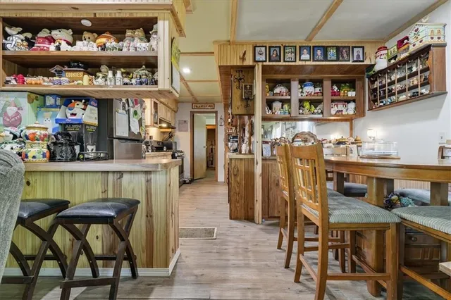 a kitchen with stainless steel appliances granite countertop a refrigerator and a stove
