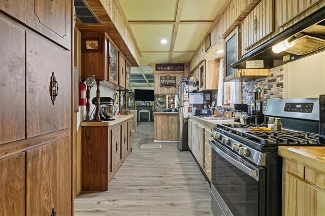 a kitchen with a sink and a window