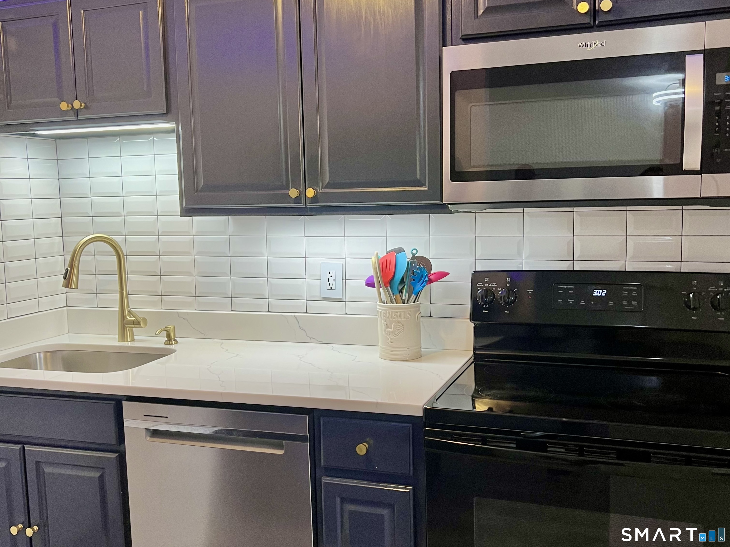 Clark Avenue, Unit 28 Bristol, CT 06010 - Photo 23 of 35 a kitchen with a sink and cabinets