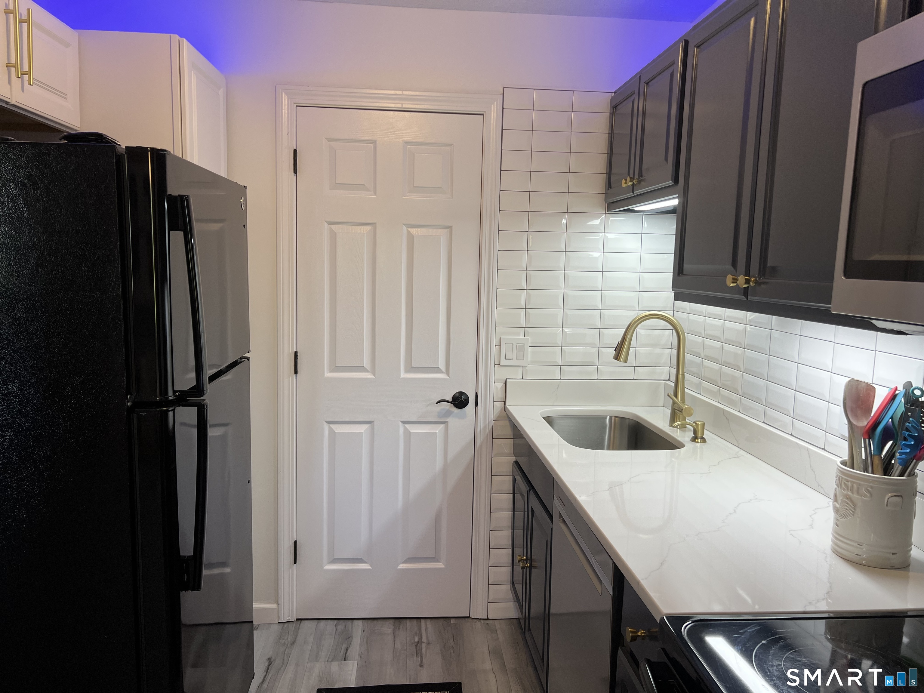 Clark Avenue, Unit 28 Bristol, CT 06010 - Photo 26 of 35 a kitchen with stainless steel appliances granite countertop a refrigerator and a sink