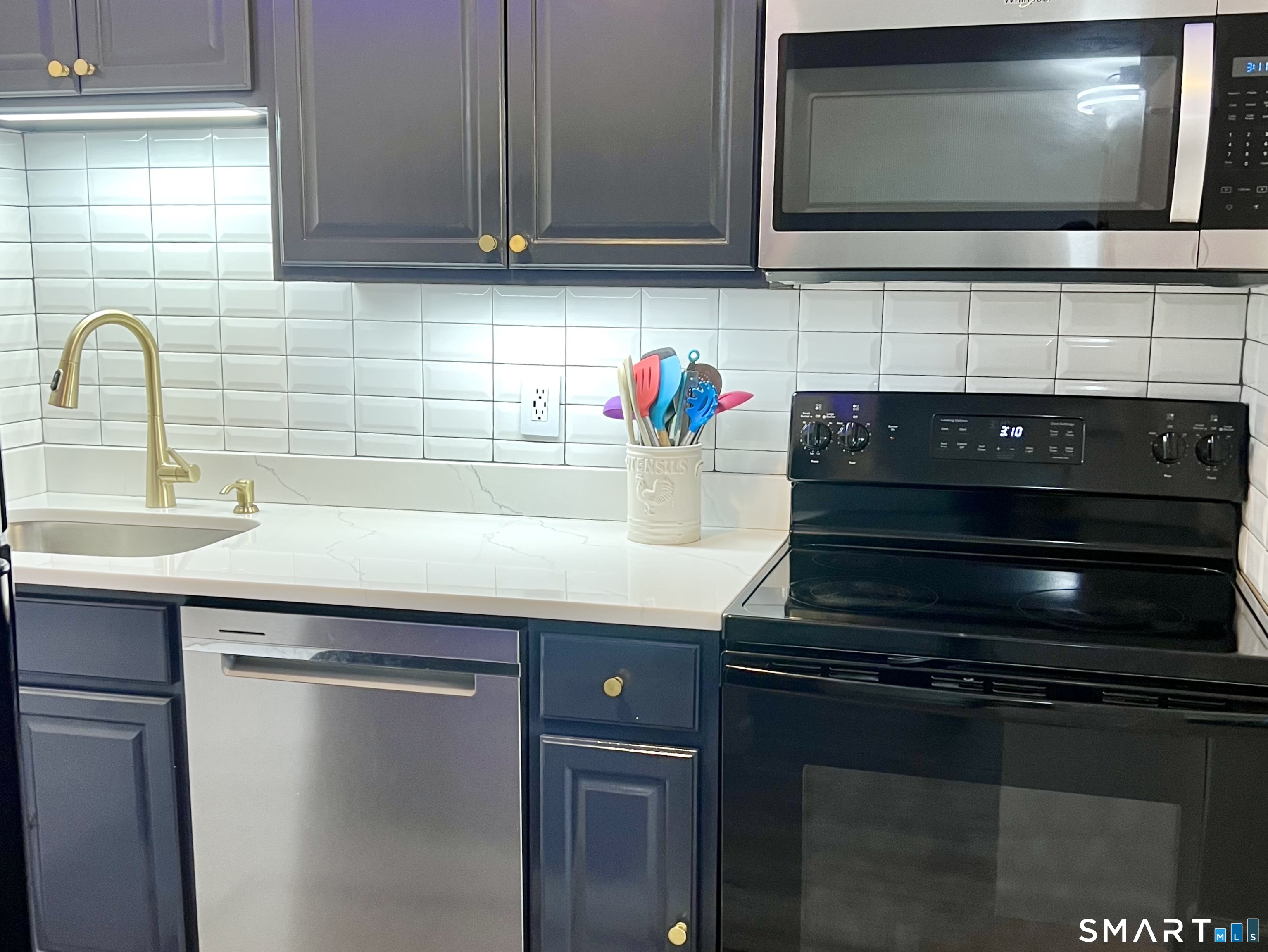 Clark Avenue, Unit 28 Bristol, CT 06010 - Photo 33 of 35 a kitchen with a sink and a microwave