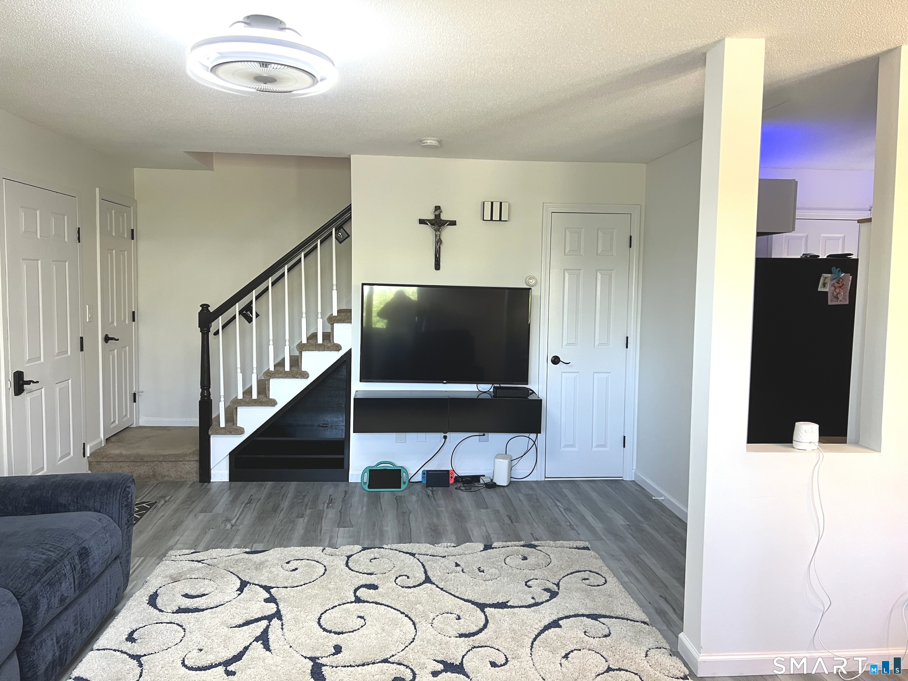 Clark Avenue, Unit 28 Bristol, CT 06010 - Photo 7 of 35 a living room with a large bed and a flat screen tv