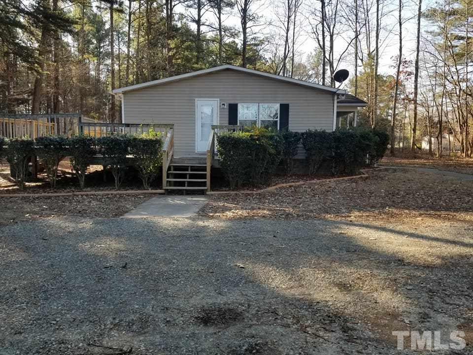 900 Milton Road Durham, NC 27712 - Photo 20 of 21 a view of a house with a yard and garage