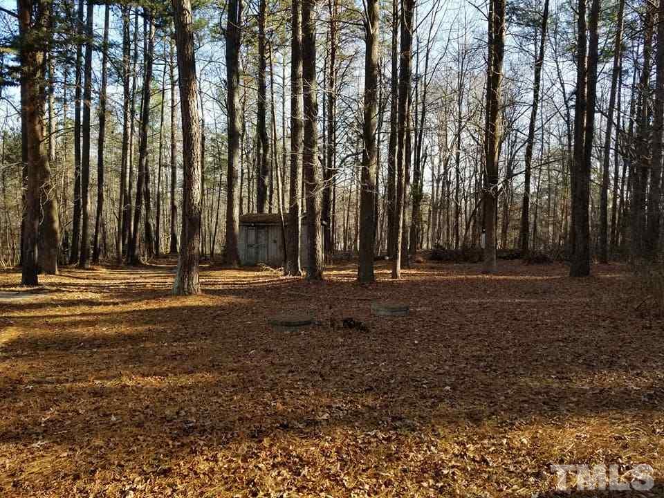 900 Milton Road Durham, NC 27712 - Photo 5 of 21 a view of outdoor space with deck and trees