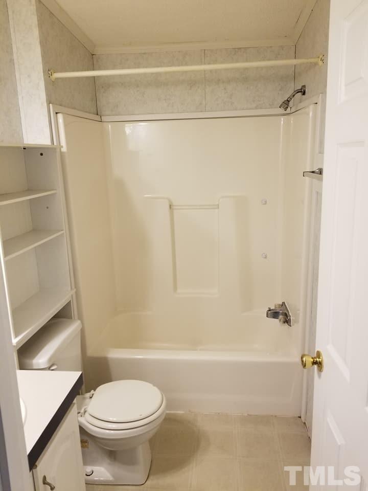 900 Milton Road Durham, NC 27712 - Photo 8 of 21 a bathroom with a shower and a toilet