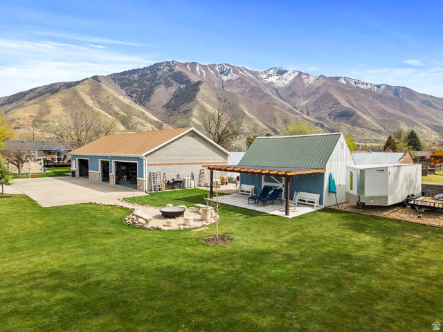 141 North 600 East Mapleton, UT 84664 - Photo 2 of 44 5 car heated detached workshop with bathroom, plumbed for compressed air, room for all the toys and tools. Barn abd firepit are also in the photo.